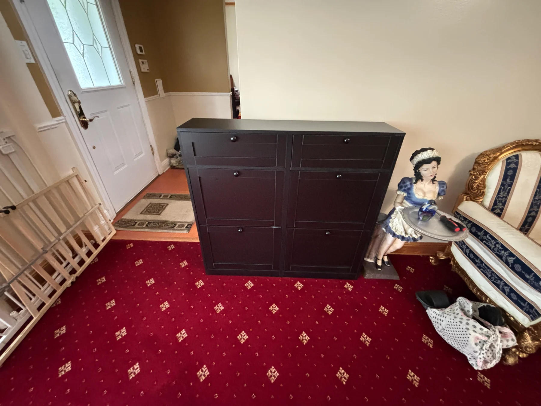 After assembly: the finished dark shoe cabinet with its storage fronts closed.