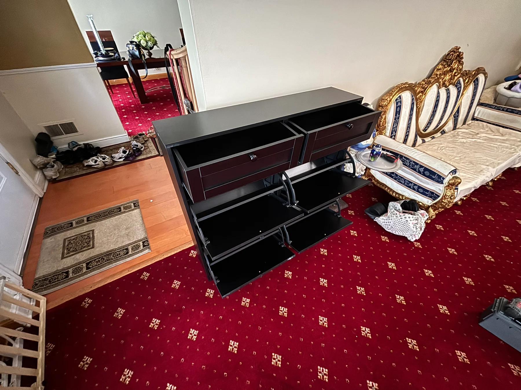 After assembly: the storage compartments opened to show the interior shoe racks.