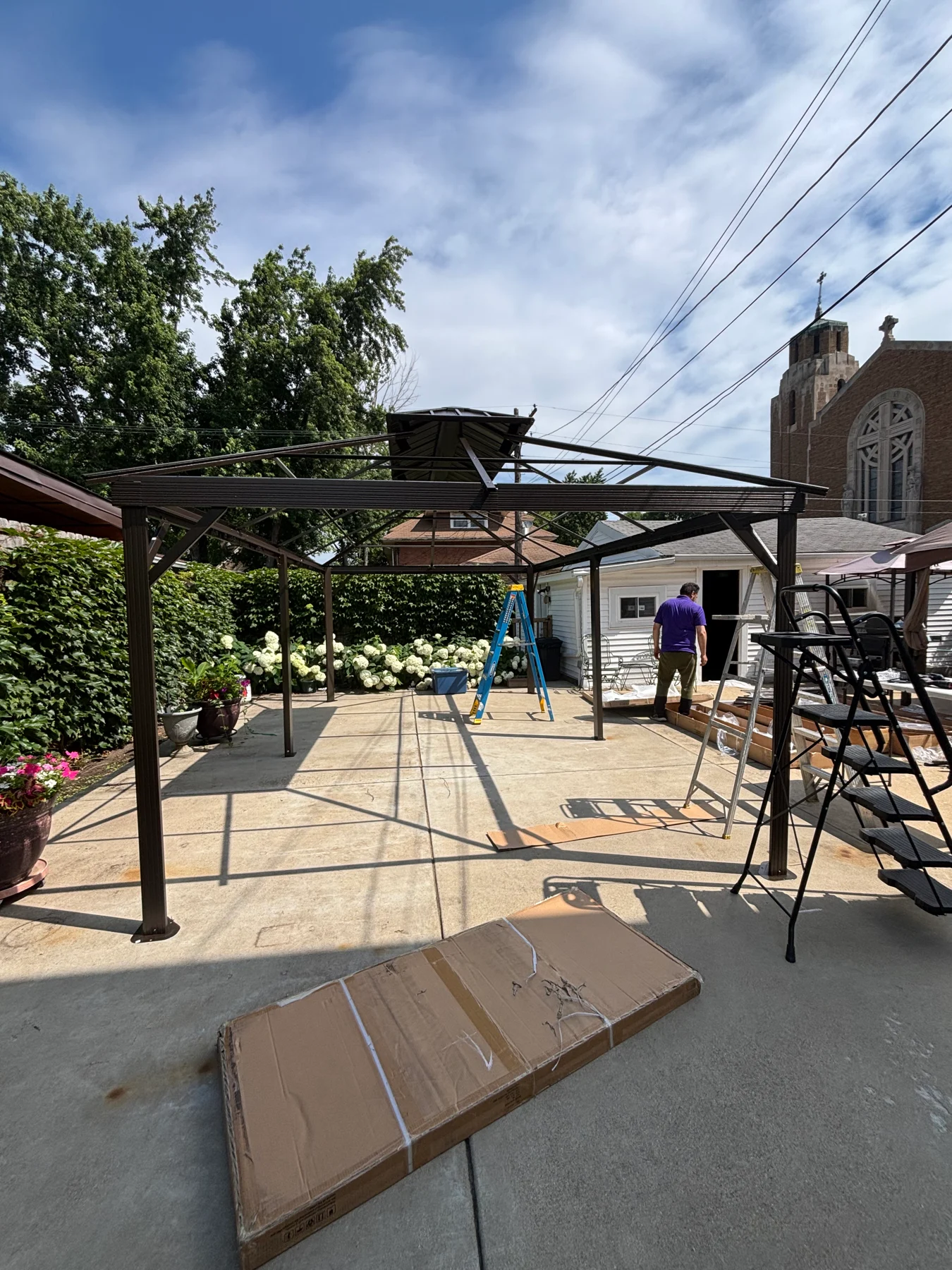Work in progress: the posts and roof frame assembled, with the main roof panels still to be fitted.