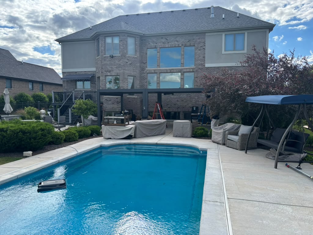 Completed pergola beside a backyard pool
